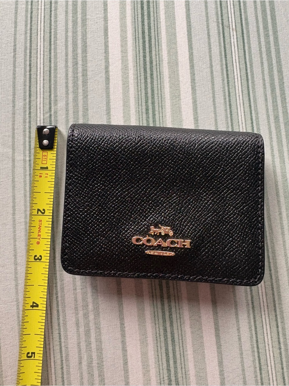 Coach Black Leather Compact Wallet with Gold Logo Accent
